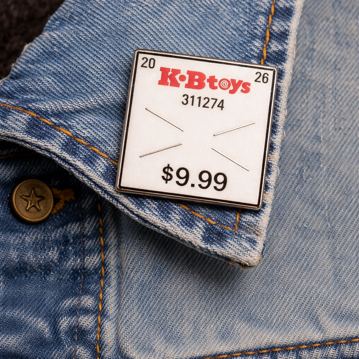 KB Toys Price Sticker Enamel Pin - Icon Heroes 